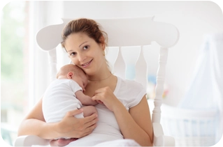 Surrogate mother smiling with intended parents